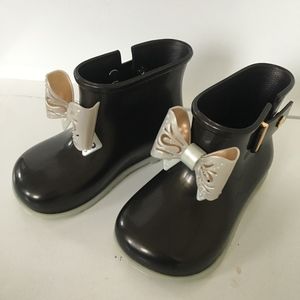 mini melissa black boots